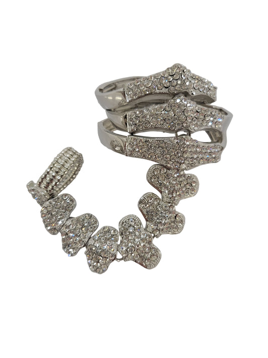 Silver jewelry set with brooch and earrings on a white background