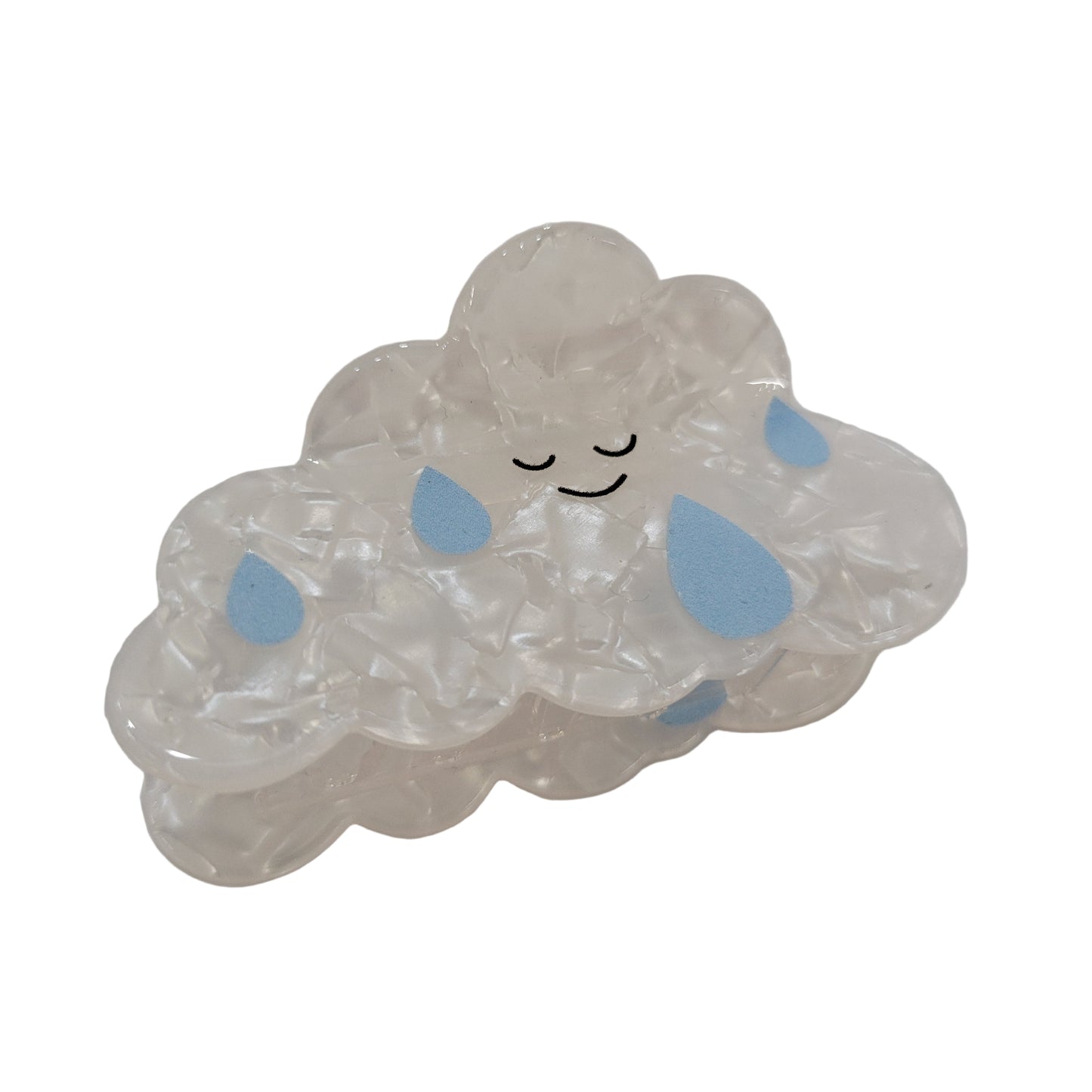 Clear gelatinous substance with blue spots on a white background