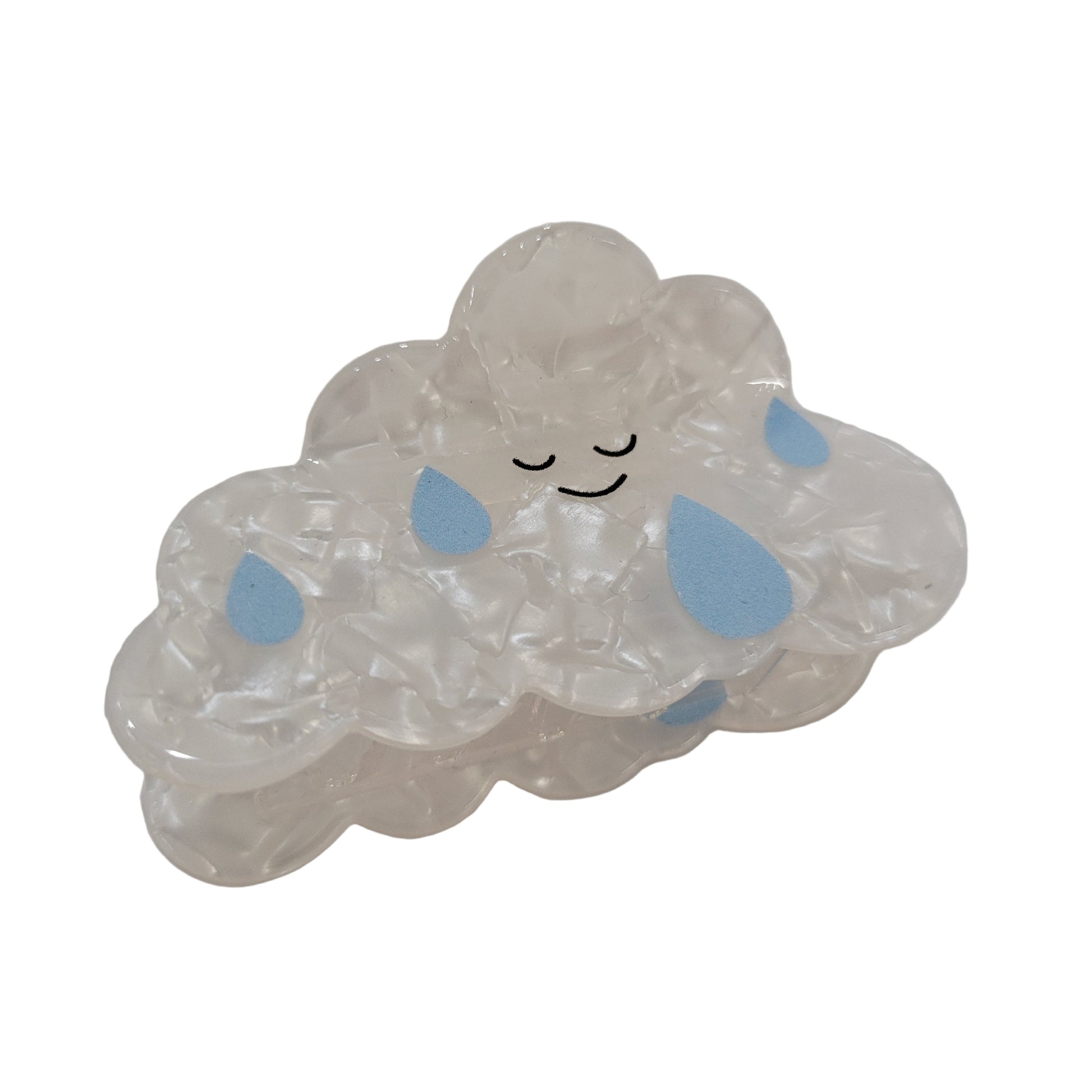 Clear gelatinous substance with blue spots on a white background