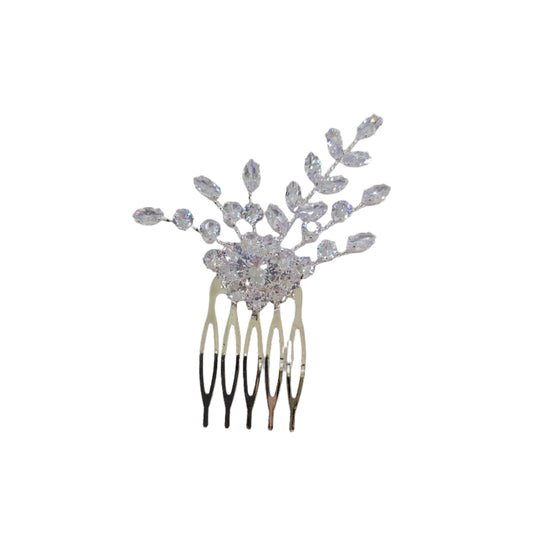 Decorative hair comb with crystals on a light gray background