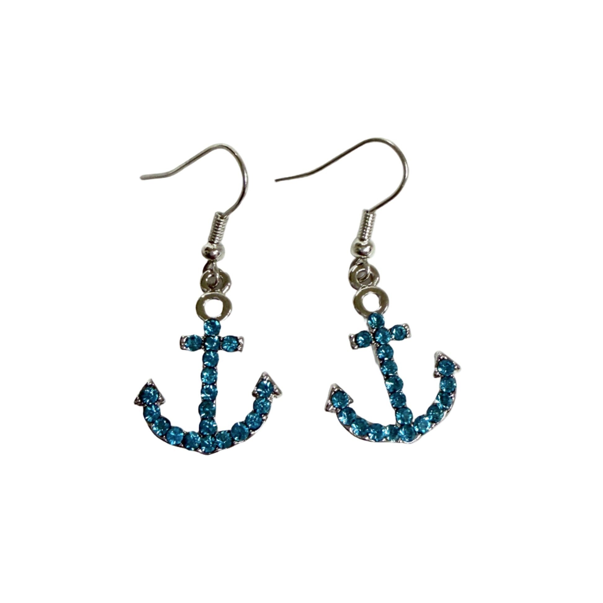 Anchor-shaped earrings with blue gemstones on a white background