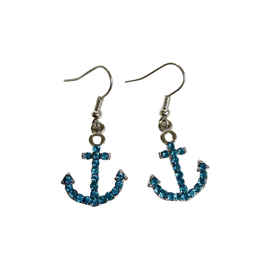 Anchor-shaped earrings with blue gemstones on a white background