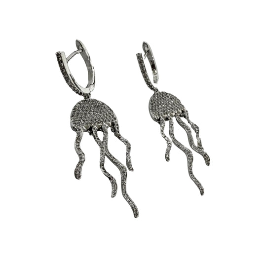Silver jellyfish-shaped earrings on a light gray background