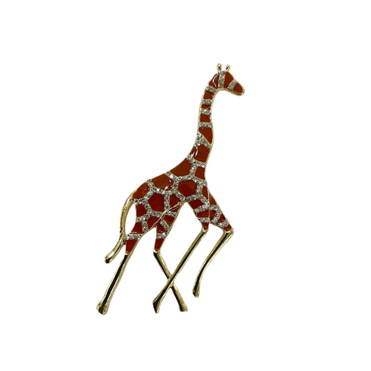 Giraffe-shaped brooch with red and gold pattern on a white background