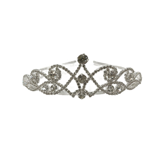 Silver tiara on a white surface